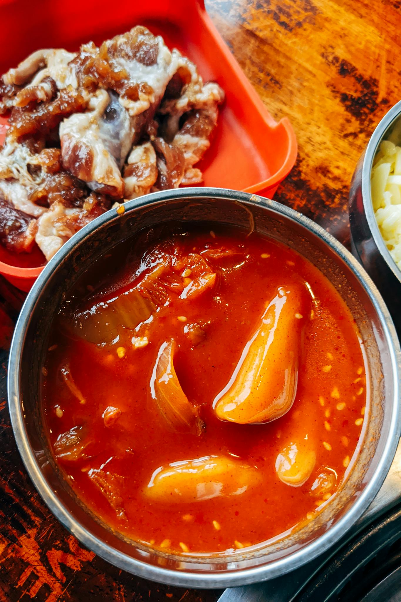 Delicious bowl of Korean kimchi stew served with tender meat. Perfect for a spicy and hearty meal.